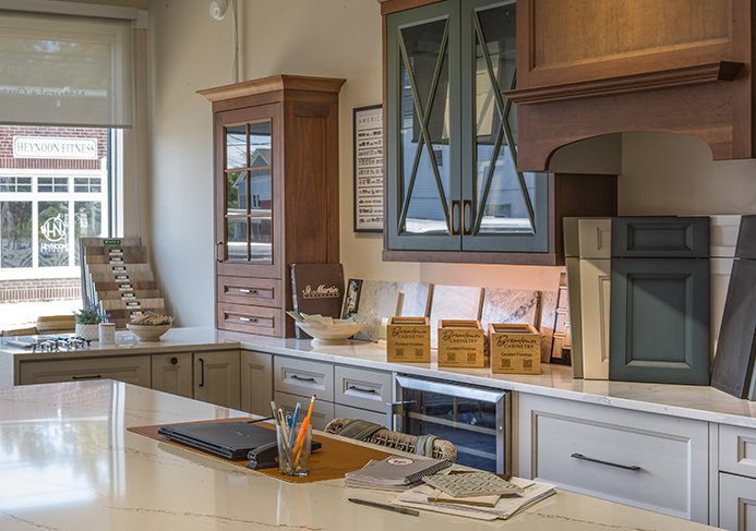 Interior view of Peter's Precision Remodeling showroom featuring custom cabinet displays, quartz countertops, and coastal flooring samples in Ocean City, NJ.